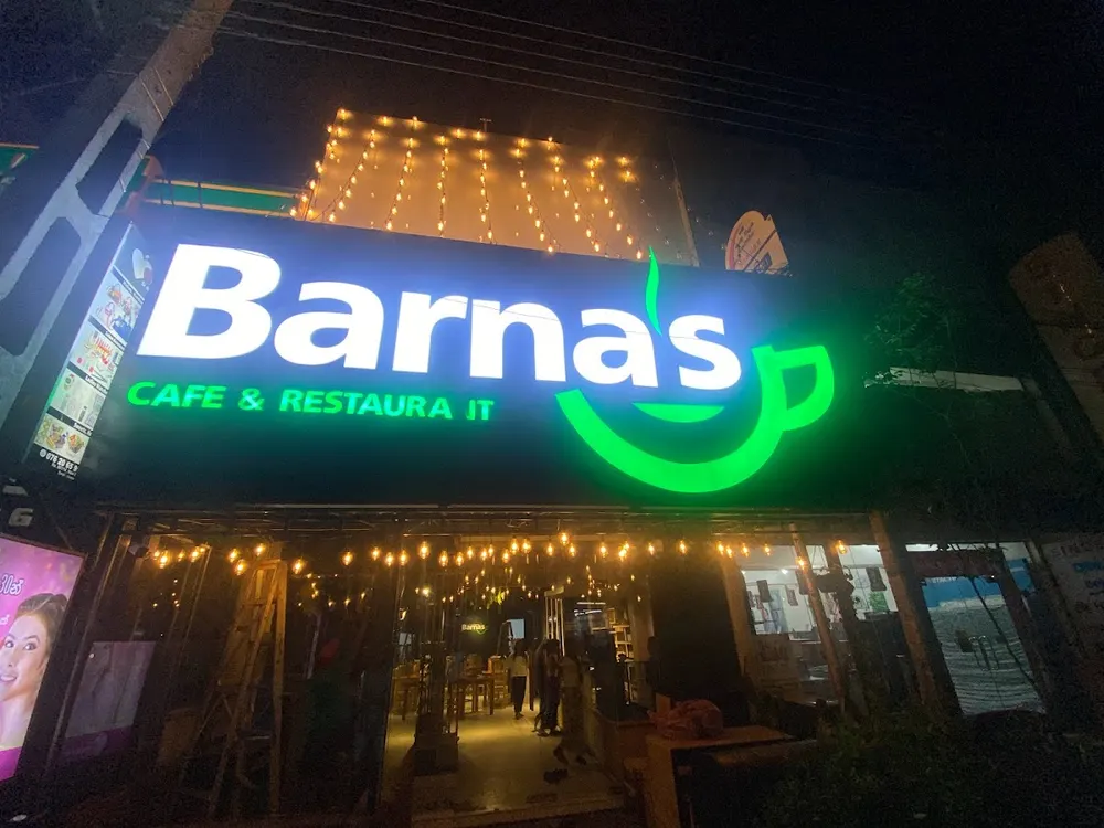 Barnaβs CafΓ© & Restaurant Anuradhapura exterior at night