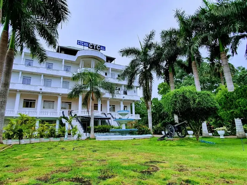 CTC Reception Hotel building surrounded by palm trees in Anuradhapura