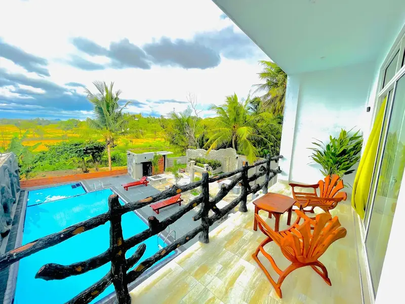 Ismatta Hotel balcony view overlooking swimming pool in Anuradhapura