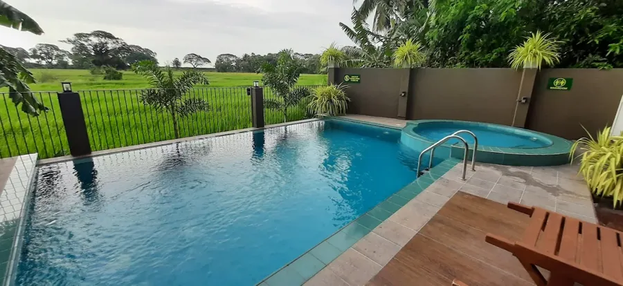 Swimming pool view at Green View Resort Anuradhapura overlooking green paddy fields